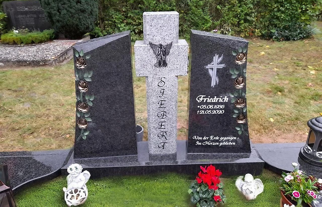 Doppelgrab - Ein Grab mit einem Kreuz und Blumen, das die Liebe und den Respekt für den Verstorbenen zeigt